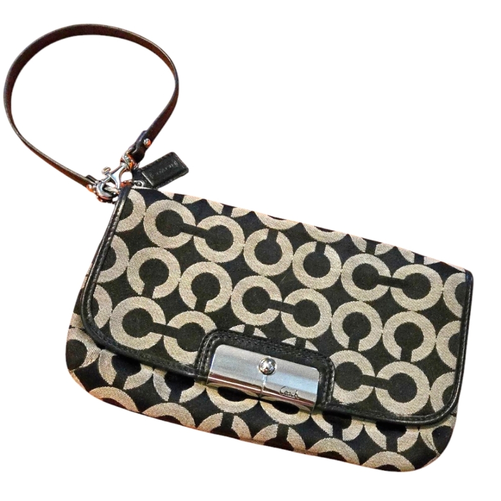 Coach Black and Tan Signature Wristlet. Very Nice Pre Owned Condition.
